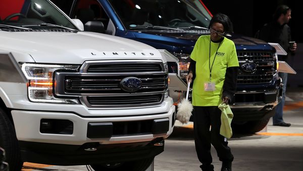 File photo of a Ford Motor worker dusting a Ford F150 Limited pickup truck. (REUTERS)