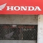 A Honda two-wheelers shop is closed during a government-imposed nationwide lockdown as a preventive measure against the COVID-19 coronavirus, in New Delhi on April 3, 2020. (Photo by Prakash SINGH / AFP) (AFP)