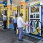 NDMC workers spray disinfectant at a Petrol Pump in Connaught Place during the nationwide lockdown in the wake of coronavirus pandemic in New Delhi. (PTI)