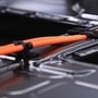 An electric cable runs along the lithium-ion battery of an all-electric Porsche AG Taycan luxury automobile on the production line inside the Porsche AG factory in Stuttgart, Germany. (This is a file photo used for representational purpose only.) (Bloomberg)