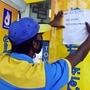 File photo: A worker put a poster `no mask no petrol` at a petrol pump as the area declared `hot spot` zone during coronavirus lockdown, in Kolkata.