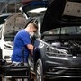 A worker wears a protective mask at the Volkswagen assembly line after VW re-starts Europe's largest car factory after coronavirus shutdown in Wolfsburg, Germany, April 27, 2020, as the spread of the coronavirus disease (COVID-19) continues.    Swen Pfoertner/Pool via REUTERS (REUTERS)