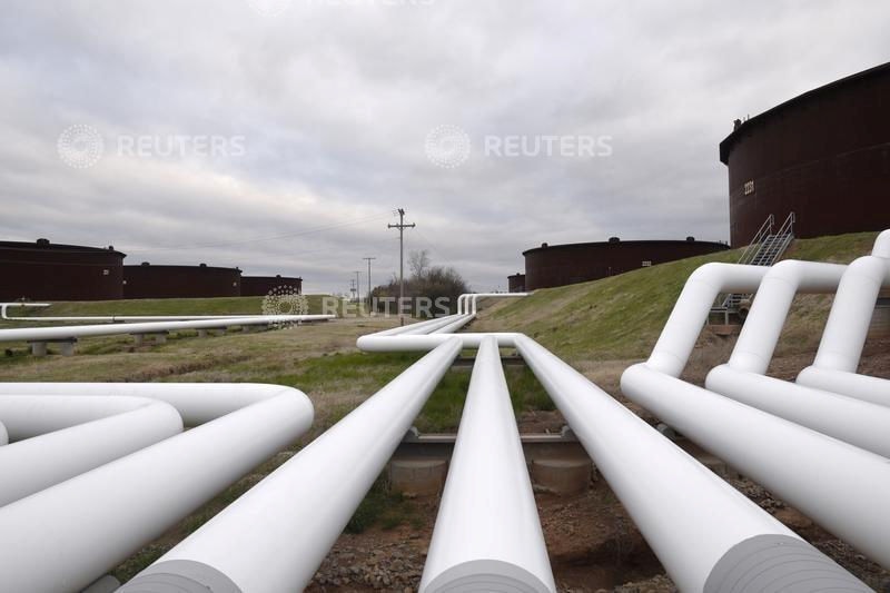 FILE PHOTO: The plunge in global crude prices -- down from USD 77 a barrel early January to mid-USD 20s now -- is highly credit negative for domestic upstream players,