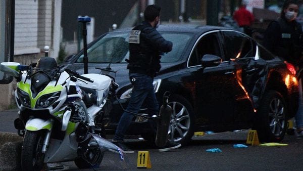 French police officers check the site where a driver injured two policemen in Colombes. (AFP)