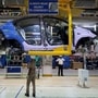 FILE PHOTO: Workers assemble a Tata Tigor car inside the Tata Motors car plant in Sanand, on the outskirts of Ahmedabad, India (REUTERS)