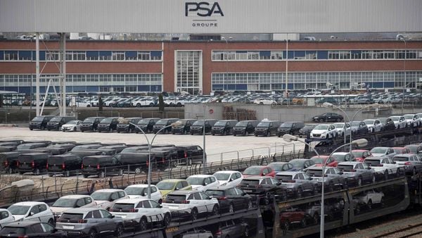 File photo: Cars are parked in a lot in front of a plant of French automaker PSA Peugeot-Citroen, at Poissy, on the outskirts of Paris. (AFP)