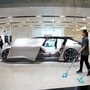Cleaners are seen next to a self-driving electric concept car NIO Eve displayed. (File photo) (REUTERS)