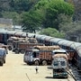 Workers unloading sacks from a goods train to the trucks to maintain the supply chain of the food and essential goods during the nationwide lockdown in Jharkhand.