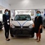 A customer receiving her new vehicle as showrooms gradually resume operations. (Photo courtesy: Maruti Suzuki)