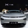 FILE PHOTO: People look at XPeng's P7 sedan model displayed at the Guangzhou auto show in Guangzhou, Guangdong province, China November 22, 2019.  (REUTERS)
