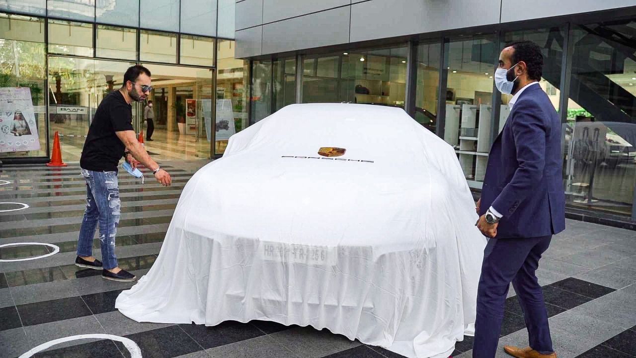 Vikas Kohli takes delivery of his new Porsche.