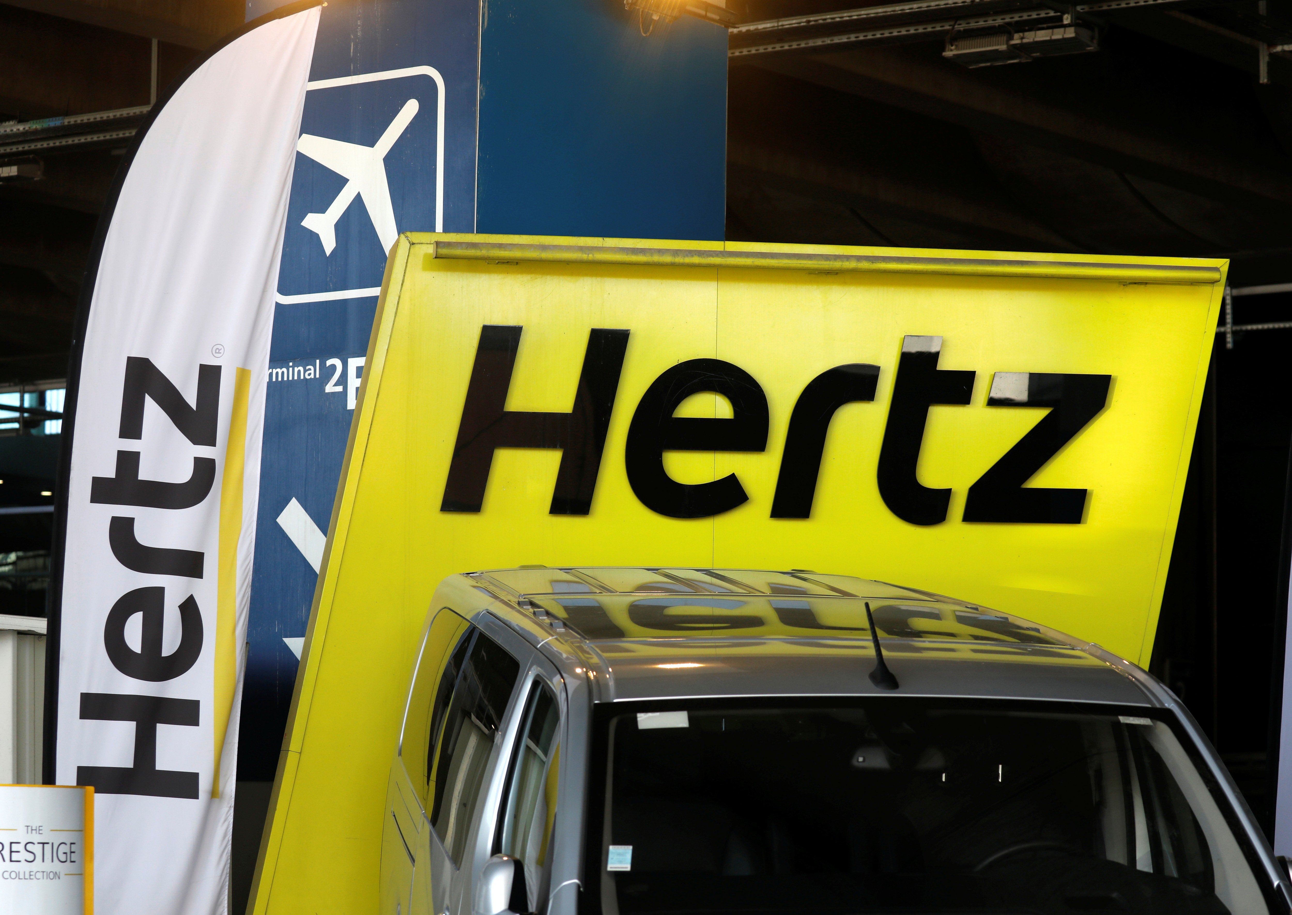 Logos of car rental company Hertz are seen outside Paris Charles de Gaulle airport in Roissy-en-France during the outbreak of the coronavirus disease (COVID-19) in France May 19, 2020. REUTERS/Charles Platiau