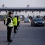 File photo: Police officers stand guard at a toll station of an expressway after travel restrictions to leave Wuhan, the capital of Hubei province and China's epicentre of the novel coronavirus disease (COVID-19) outbreak, were lifted. (REUTERS)