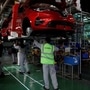 File photo: Renault employees, wearing protective face masks, work on the automobile assembly line of Renault ZOE cars. (REUTERS)