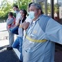 Renault workers and union representatives, wearing protective face masks. (REUTERS)