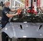 Employees of British luxury carmaker Aston Martin at work in St Athan factory.