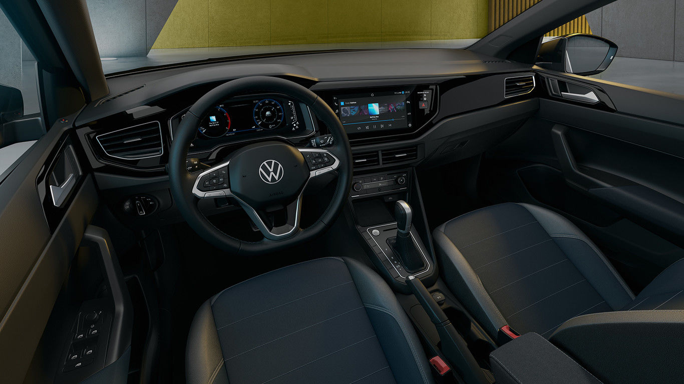 The interior of the Volkswagen Nivus SUV looks modern with shiny surfaces.