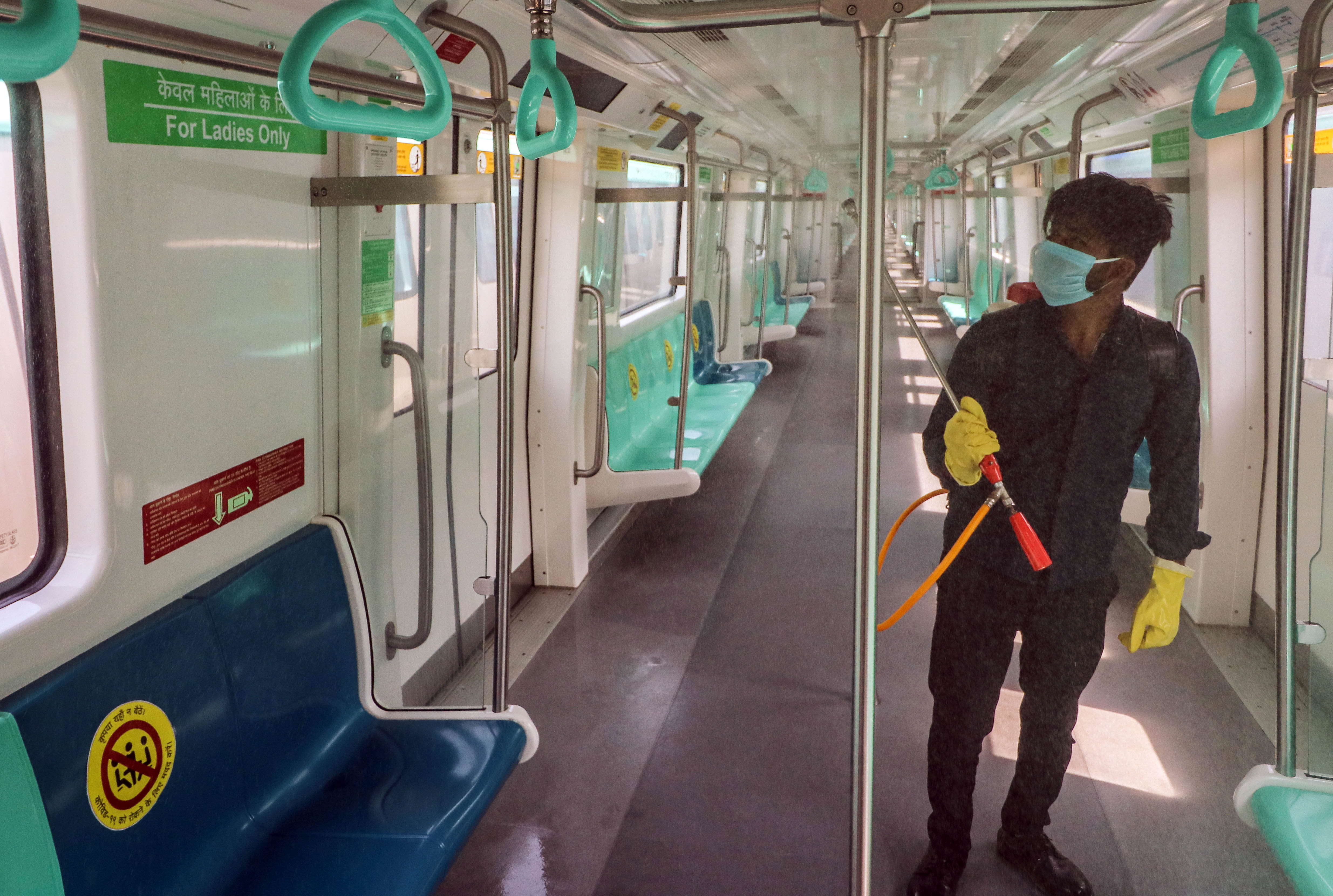 Workers sanitize metro compartments during the coronavirus lockdown, in Greater Noida. According to the CSE, 73 per cent respondents have preferred to move to public transport if it meets high quality standards for services.