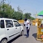 Police check vehicle at a checkpoint set up on road in Noida-Delhi Border during the nationwide lockdown.