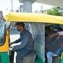 Auto rickshaw seen with a plastic layer divider between passenger and driver side in New Delhi. (ANI)