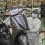 File photo of Honda Motorcycle and Scooter India (HMSI) workers at a facility after resuming work post lockdown.