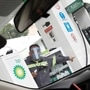 File photo: An employee of British Petroleum (BP) wearing a plastic shield, gives directions to the driver at the gas station, as the coronavirus disease continues in Mexico City. (REUTERS)