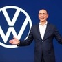 File photo: Ralf Brandstaetter, CEO of the Volkswagen Passenger Cars brand gestures in front of the revised logo of German carmaker Volkswagen. (Reuters)
