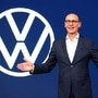 File photo: Ralf Brandstaetter, CEO of the Volkswagen Passenger Cars brand gestures in front of the revised logo of German carmaker Volkswagen. (Reuters)