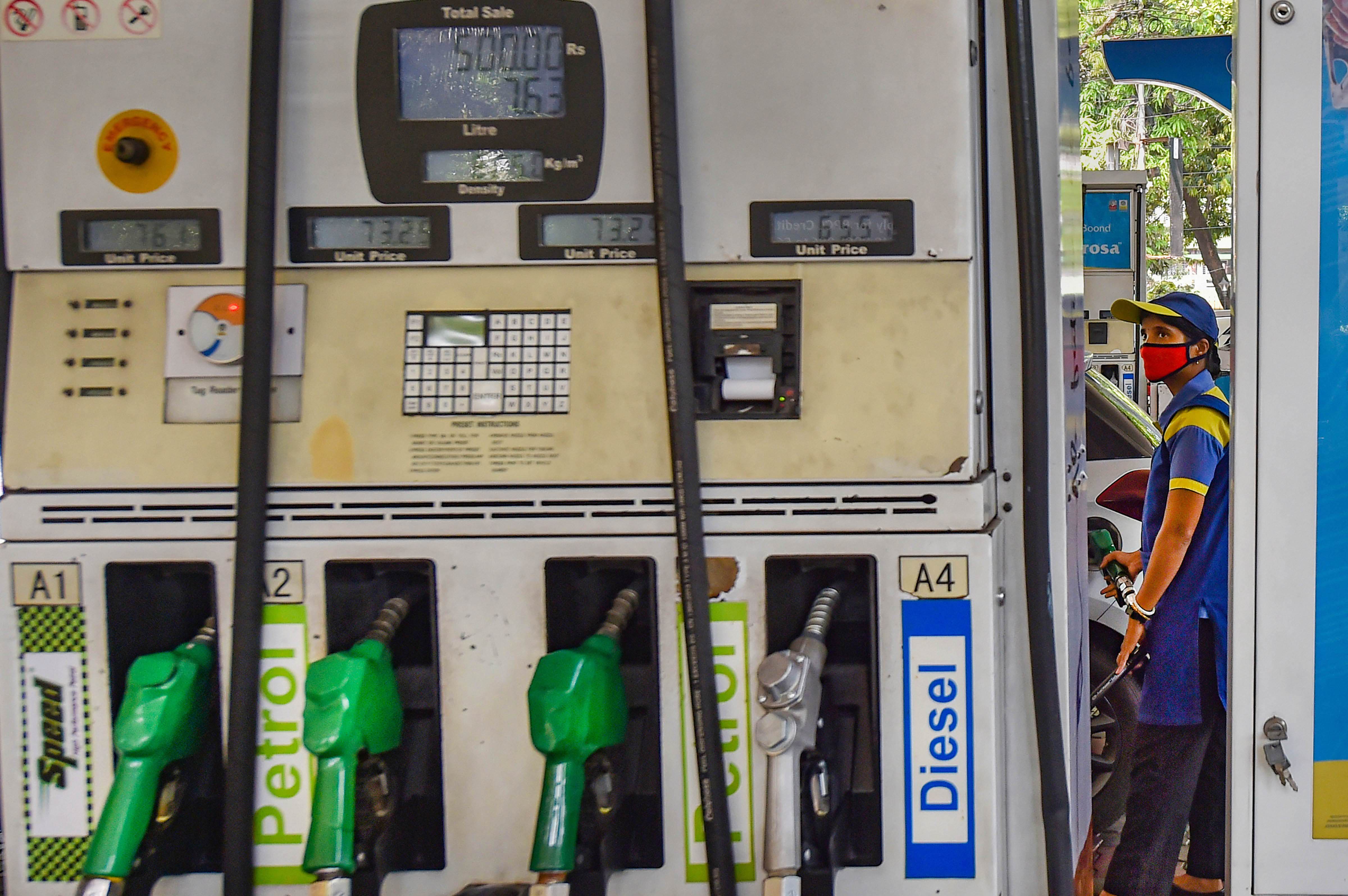 A woman on duty at a petrol pump. (Representational photo) A woman on duty at a petrol pump. (Representational photo)