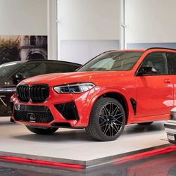 The historic vehicle is a Toronto Red Metallic BMW X5 M Competition equipped with a 617-horsepower M TwinPower Turbo V-8 engine.