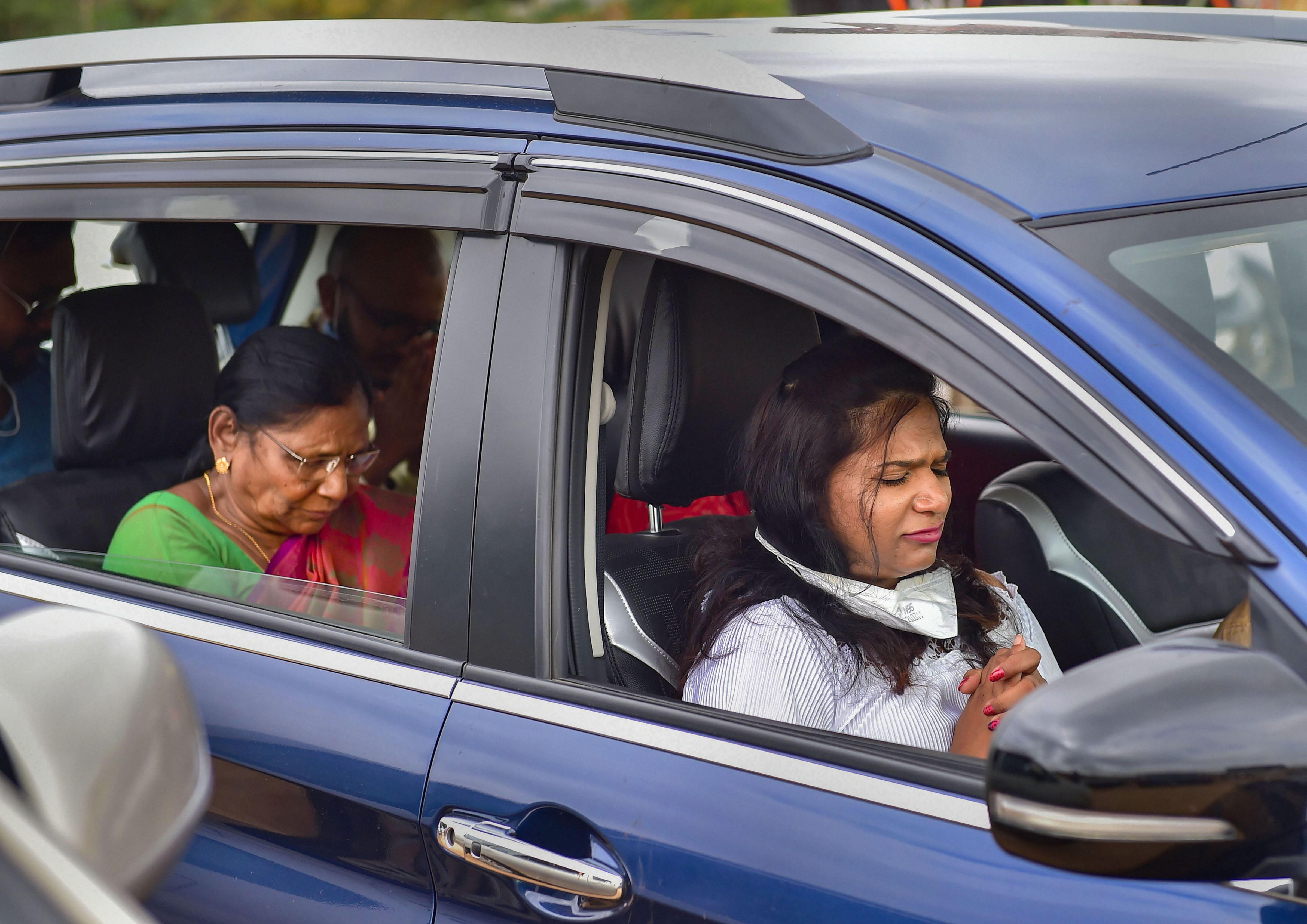 Members of the church, adhering to social distancing norms, sang and prayed while sitting in their cars after parking them on ground during drive-in worship. Members of the church, adhering to social distancing norms, sang and prayed while sitting in their cars after parking them on ground during drive-in worship.