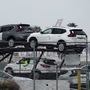New Nissan Motor Co. Rogue vehicles sit on a car carrier trailer inside an automotive processing terminal at the Port of Los Angeles in Wilmington, California. (Bloomberg)