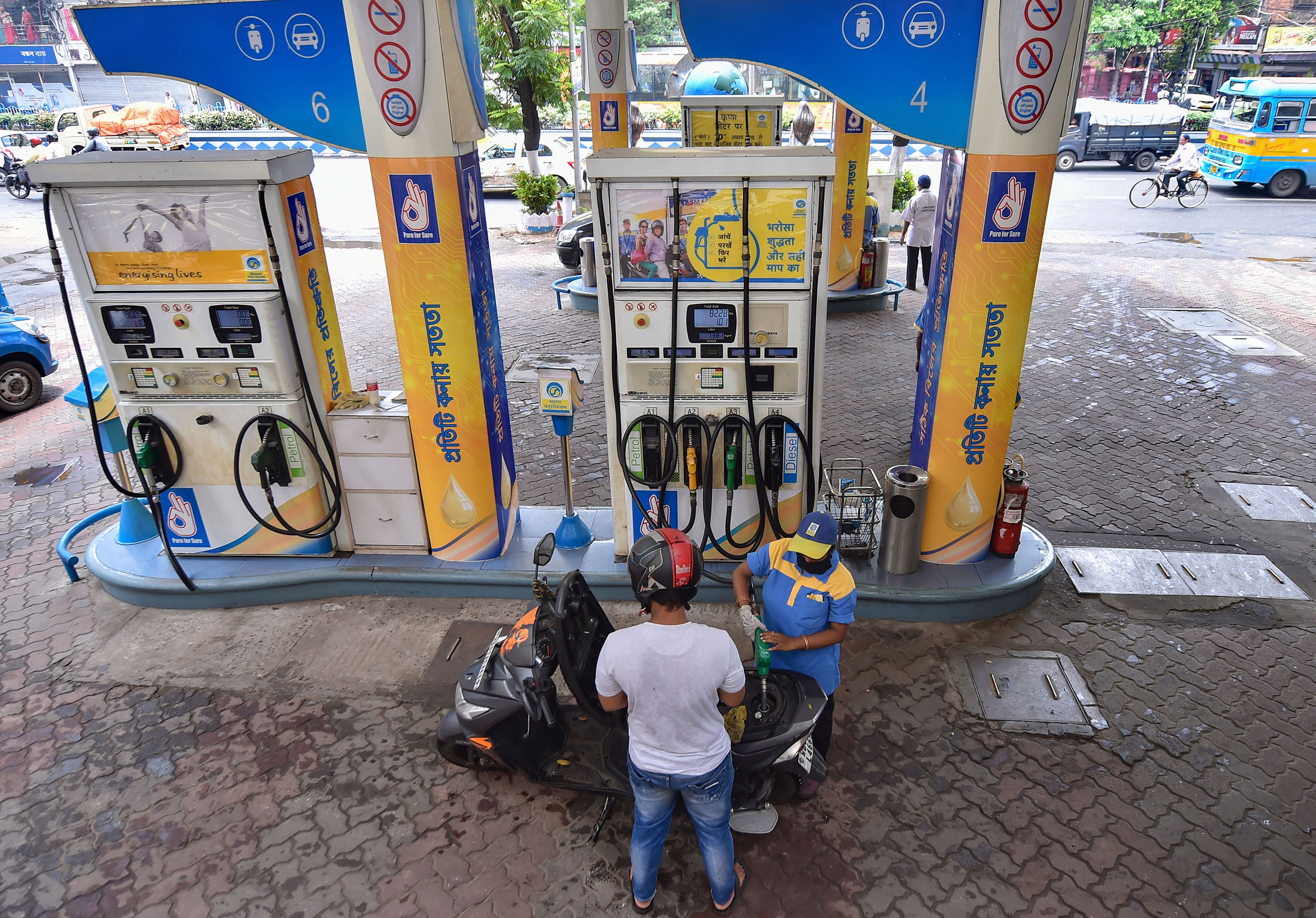 An employee attends to a customer at a petrol pump during unlock 1.0 process of the Covid-19 lockdown, in Kolkata. (File photo used for representational purpose) An employee attends to a customer at a petrol pump during unlock 1.0 process of the Covid-19 lockdown, in Kolkata. (File photo used for representational purpose)