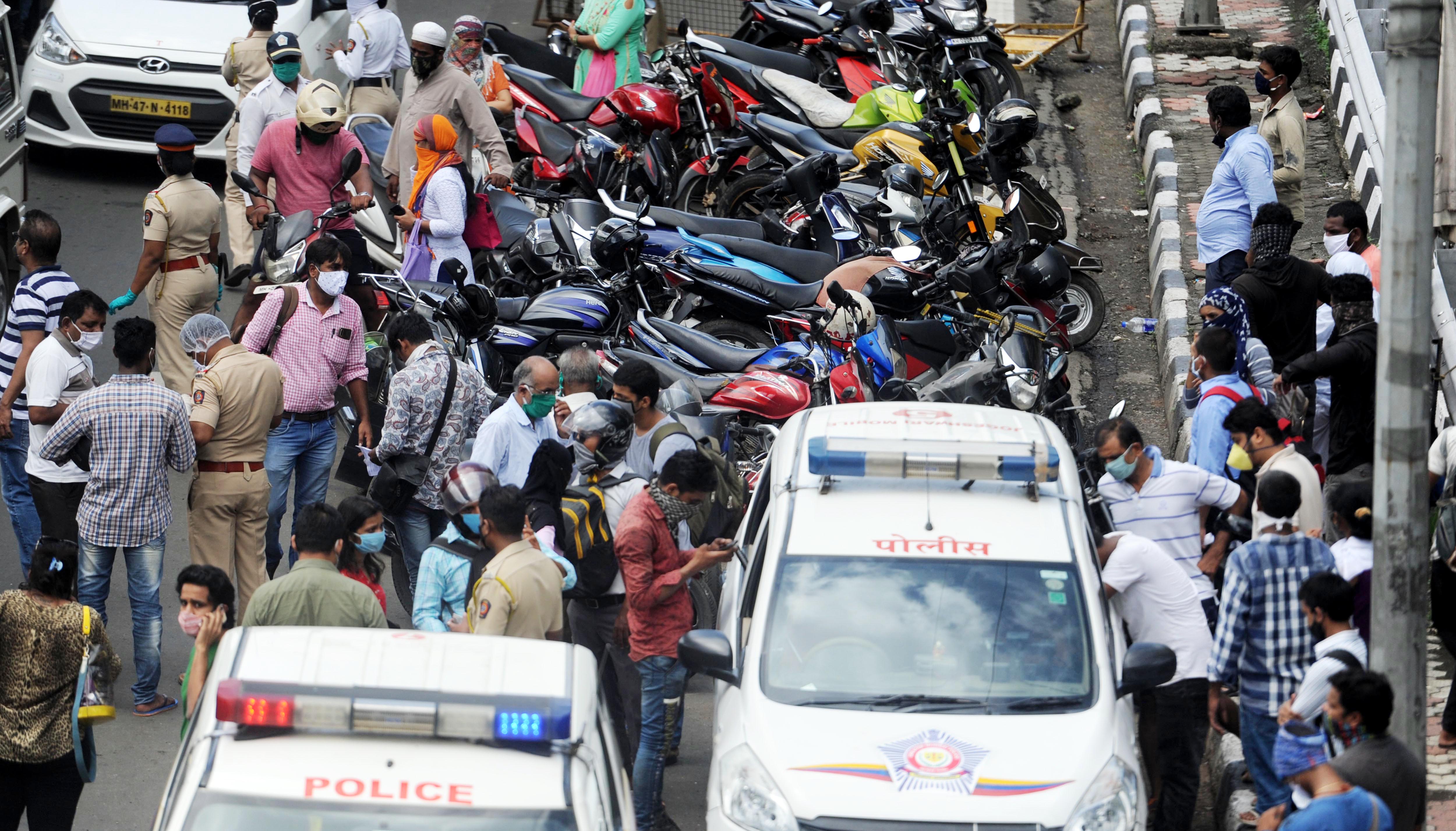 Police conduct checks on the movement of vehicles at Western Express Highway.