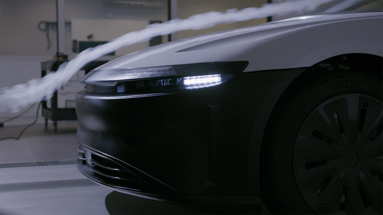 Side air intakes in the front fascia smooth airflow around the typically turbulent wheel wells.