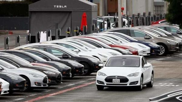 File photo - A Tesla Model S electric vehicle drives along a row of occupied superchargers at Tesla's primary vehicle factory in Fremont, California. (REUTERS)