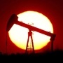 The sun sets behind an oil pump near Paris, France. (REUTERS)