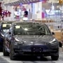 FILE PHOTO: Tesla China-made Model 3 vehicles are seen during a delivery event at its factory in Shanghai, China. (REUTERS)