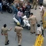 Police personnel stop commuters at Delhi Noida Border after it was sealed during the two day lockdown imposed by the state government to curb the spread of coronavirus.