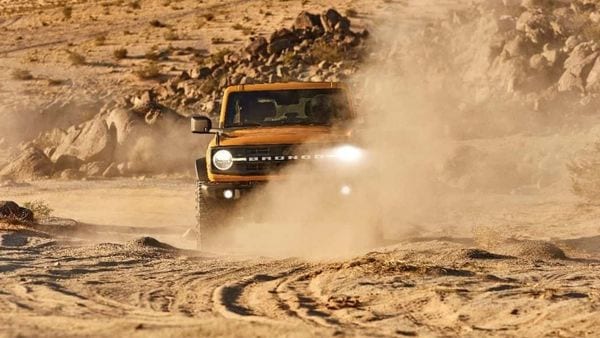 2021 two-door Bronco Black Diamond series in Cyber Orange Metallic Tri-Coat with available Sasquatch off-road package. 2021 two-door Bronco Black Diamond series in Cyber Orange Metallic Tri-Coat with available Sasquatch off-road package.