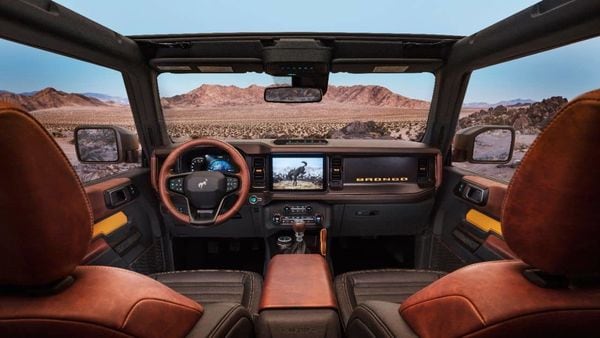 2021 Bronco interior is highlighted by a 12-inch SYNC 4 system, optional leather trim seating, console-mounted transmission shifter/selector and G.O.A.T. Modes control knob.