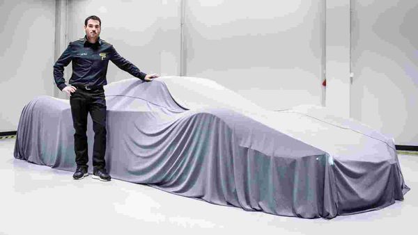 Spyros Panopoulos with his hypercar under the wraps.