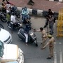 Police personnel stop commuters at Delhi Noida Border after it was sealed during the two day lockdown imposed by the state government to curb the spread of coronavirus. (File photo)