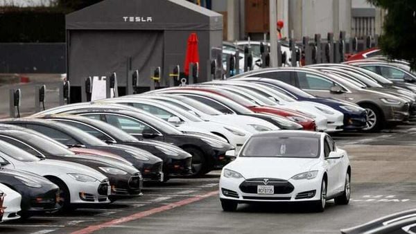 File photo - A Tesla Model S electric vehicle drives along a row of occupied superchargers at Tesla's primary vehicle factory in Fremont, California. (REUTERS)