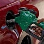 File photo: A worker holds a nozzle to pump petrol into a vehicle at a fuel station in Mumbai. (REUTERS)