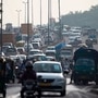 Commuters make their way after work during a rush hour after a monsoon rainfall in Delhi. (AFP)