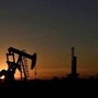File photo - A pump jack operates in front of a drilling rig at sunset in an oil field in Midland, Texas. (REUTERS)