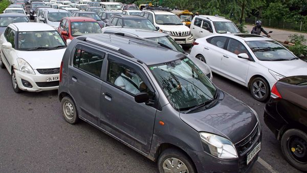 File photo - A view of a long queue of cars as UP Police checking curfew pass for the entry in Uttar Pardesh at Delhi-UP border.