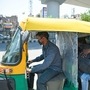 An auto rickshaw is seen with a plastic layer divider between passenger and driver side in New Delhi on Wednesday (May 19).