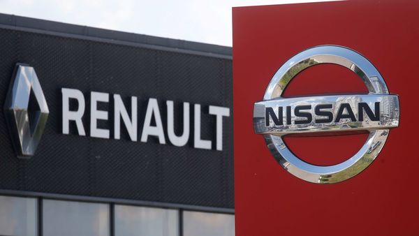 The logos of car manufacturers Nissan and Renault are pictured at a dealership. (File photo) (REUTERS)